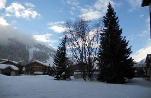 Val-d'Isere Apartment | Élégant 4 pièces avec terrasse plein Sud, cheminée, parking couvert, au centre proche pistes et commodités - FR-1-694-91