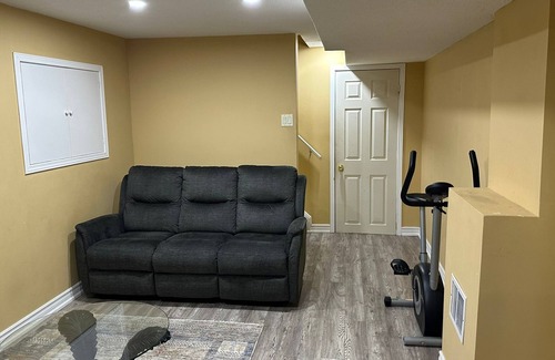 Brampton House | 1 bedroom basement suite with spacious living room and laundry, no kitchen.