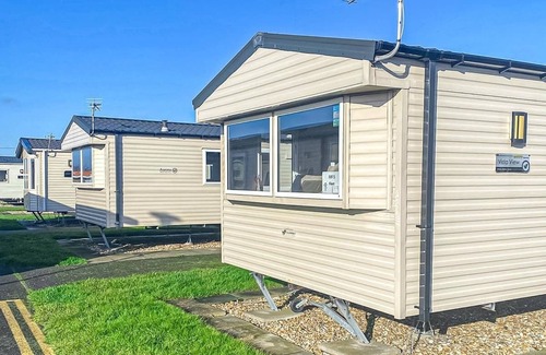 Chapel Saint Leonards House | 12ft-wide stylish and comfortable caravan with one double and one twin.