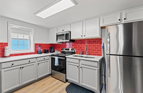 Crescent Beach Apartment | 2 bedroom Condo Steps from Beach Pet Friendly
