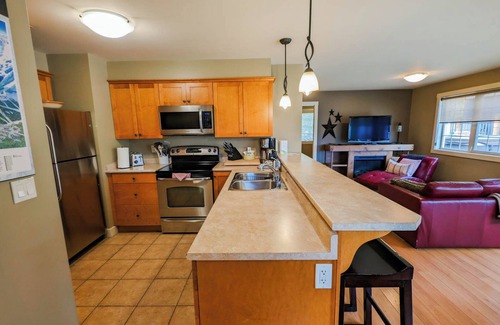 Golden Condo | 2-bedroom condo with hot tub and mountain views