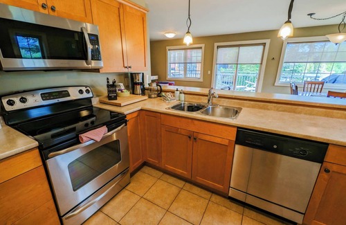 Golden Condo | 2-bedroom condo with hot tub and mountain views