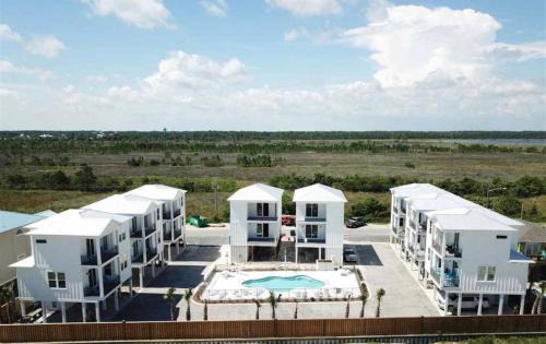 Gulf Shores House | 2 Bedroom Dog Friendly Cottage with Bunks, Sleeps 10, Heated Outdoor Pool, Walk to Beach