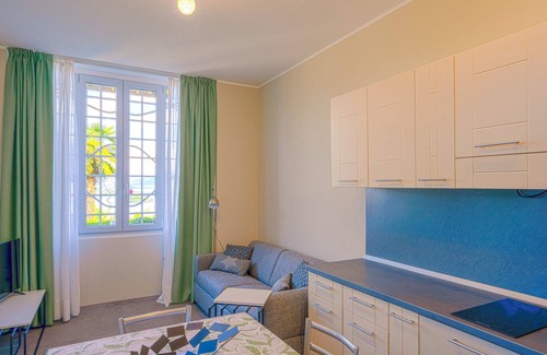 Carciano Apartment | 2-room apartment with terrace and garden in an Art Nouveau villa with communal pool