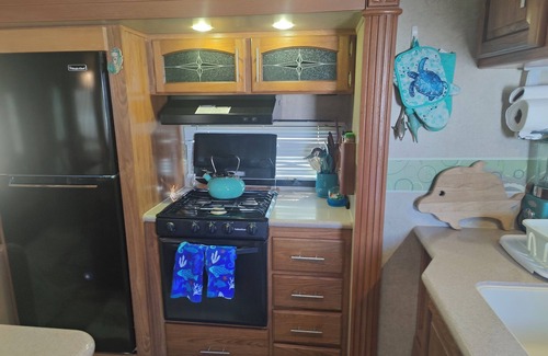 North Topsail Beach House | 35 ft RV, large deck, intercoastal sunset, campground across street from ocean