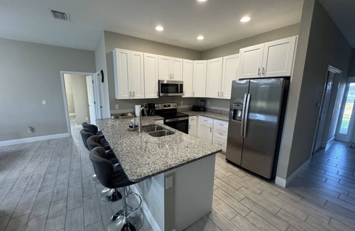 Burnt Store House | 4 King Bedroom Home with Large TVs in All Rooms - Brand New Home!