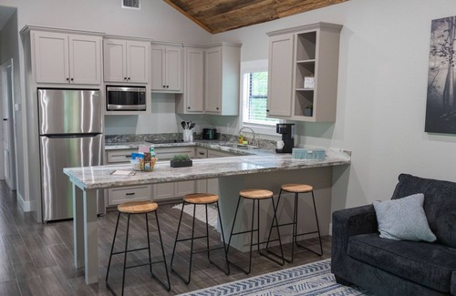 Livingston Cabin | A Cozy Getaway Right on the Water, Two Creeks Crossing Resort