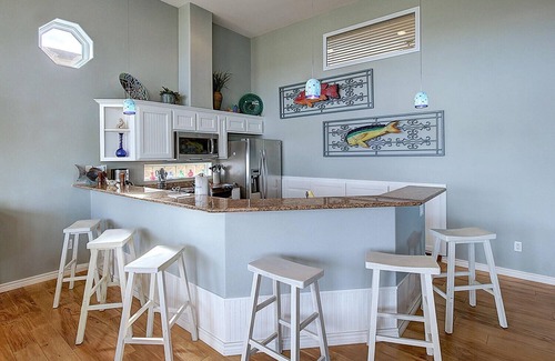 Port Aransas Condo | A fully remodeled condo overlooking a lush pond! Shared Pool! Boat Parking!