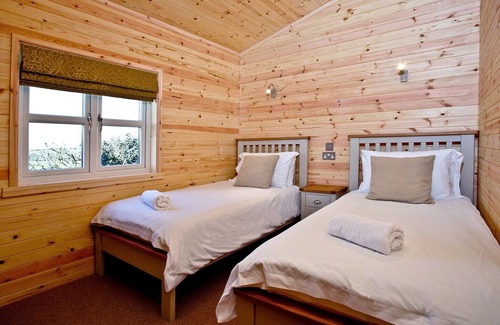 St Merryn Cabin | A light and spacious lodge with one double with walk in wardrobe and ensuite shower and one twin.