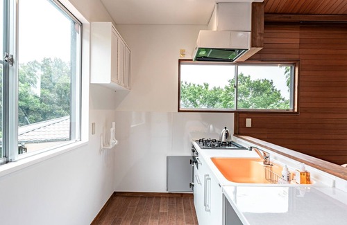 Yawatano House | A rental villa with a large garden that doubles as a dog run surrounded by trees/Ito Shizuoka