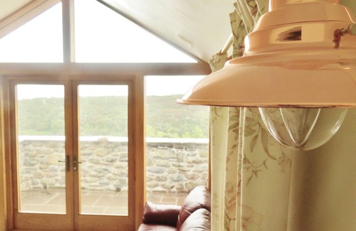 Barmouth Cottage | A Sea and Mountain Panorama from this charming stone barn