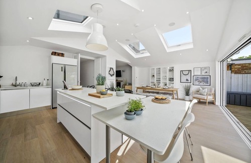 Windsor House | A stunning five-bedroom home located in the heart of Windsor driveway parking!
