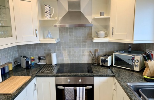 Rhosneigr Apartment | A top floor seaside apartment sleeping 5 in 2 bedrooms with panoramic sea views.