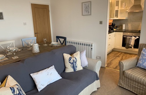 Rhosneigr Apartment | A top floor seaside apartment sleeping 5 in 2 bedrooms with panoramic sea views.