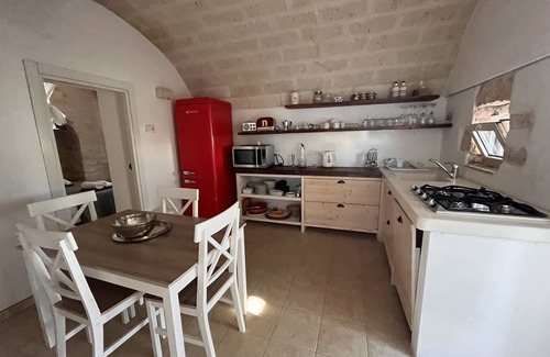 Ostuni Villa | "Al Guappo D'oro," trullo with pool nestled in the Apulian countryside.