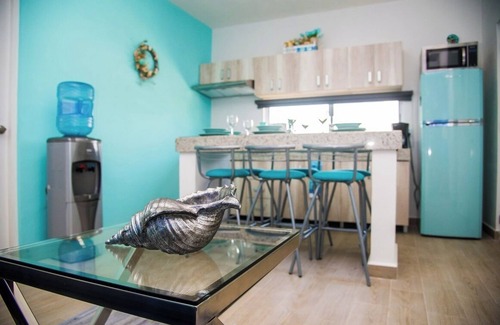 Luis Donaldo Colosio Condo | Amazing 2 BD 2 Bath | Rooftop patio & pool | Walk to beach | Family friendly