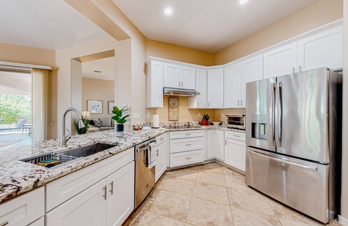 Corte Bella House | Amazing home with fitness room, tennis court, hot tub, pool, kitchen, & patio