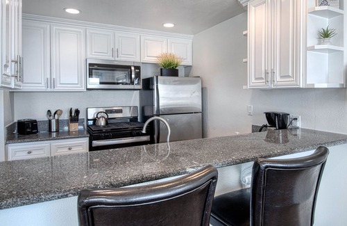 West Newport Condo | Amazing location with an amazing, newly-remodeled lower unit right on the sand!