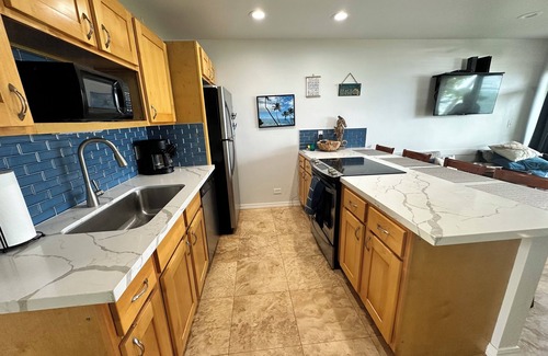 Wailua Condo | Amazing views from this ground floor, corner unit steps from the beach!