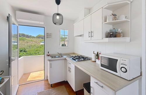 Arenal d'en Castell Apartment | Apartamento con Piscina y Solarium