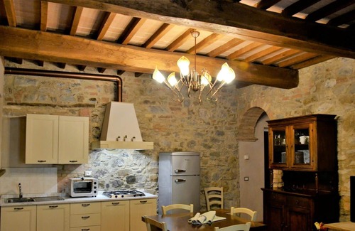 Chianni Villa | Apartment in villa with pool, WIFI, sauna, hot tub, TV, patio, pets allowed, panoramic view, parking