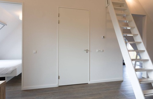 Oostkapelle Apartment | Apartment with balcony on the sunny side, close to nature and beach.