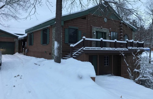 Grayling House | Ausable River waterfront 4-bed house in Grayling w/dock, patio, firepit, garage.