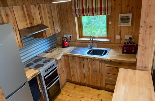 Taynuilt Cabin | Authentic log cabin close to loch shore, with hot tub & wood burning stove.