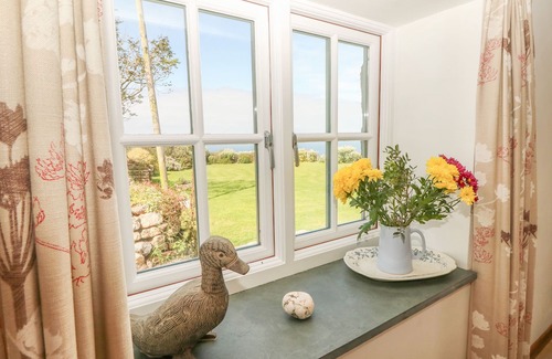 Chysauster Cottage | BACK OF BEYOND, pet friendly, with open fire in St Ives