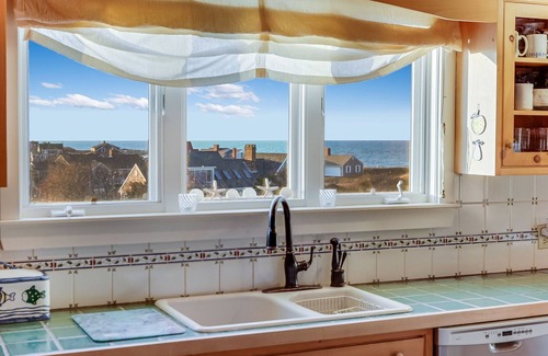 Dennis House | Bay Side with a shared private beach.