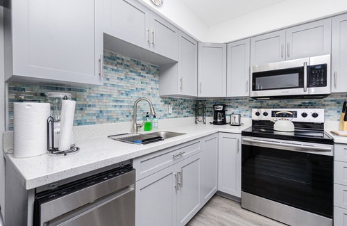 Englewood Condo | BAYFRONT, TOP FLOOR END UNIT, VIEWS, HEATED POOL, PRIVATE BEACH, BOAT SLIPS