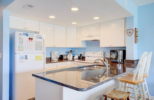 Surf City Condo | Beach condo with pool, sundecks, outdoor showers & direct beach access