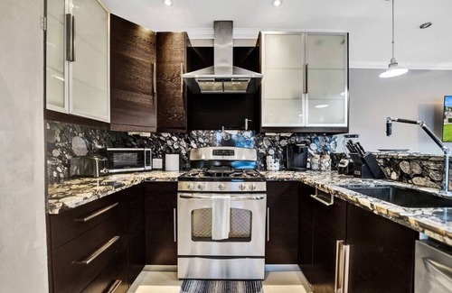 Hendricks and Venice Isles Apartment | Beach Isles: Modern 1BR Waterfront Apartment with Patio