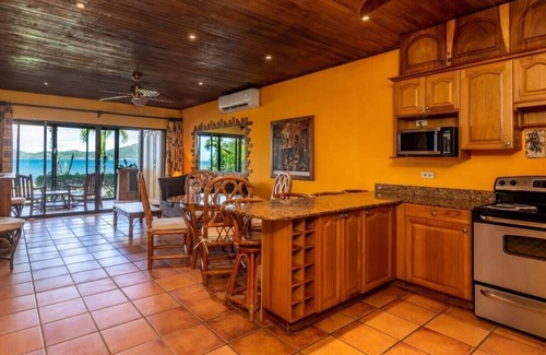 Playa Flamingo Condo | Beachfront Condo with Warm, Rustic Interiors & Direct Access to Playa Flamingo