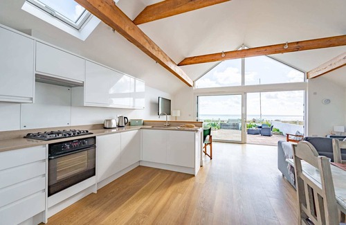 Pevensey House | Beachfront Getaway with Breathtaking Views & Family Comfort.