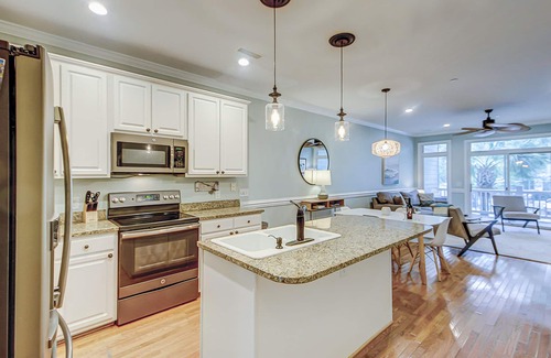 Folly Beach Villa | Beachy, three-story villa w/deck & shared pool - walk downtown & to the beach