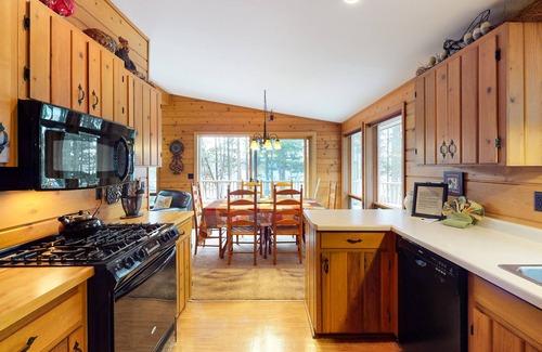 Eagle River House | Beautiful cabin with private dock, canoe, & shared tennis/basketball - dogs OK