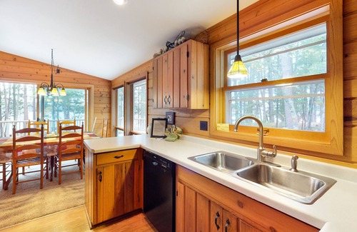 Eagle River House | Beautiful cabin with private dock, canoe, & shared tennis/basketball - dogs OK