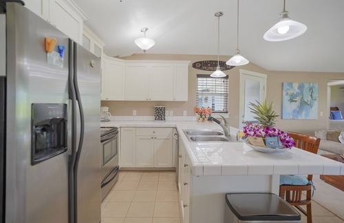 Princeville Condo | Beautiful condo with pool with waterfall, hot tub & mountain view - near shops