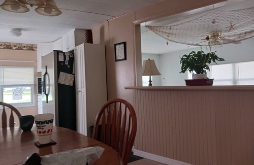 New Smyrna Beach Cottage | Beautiful modular home in scenic river complex.