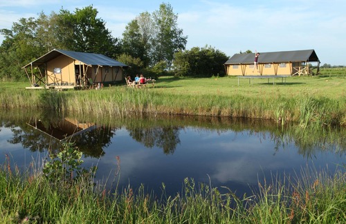 Enumatil Cabin | Beautiful furnished safari tent and circus wagon with private bathroom.