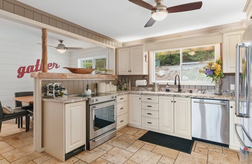 Muskoka Lakes Cottage | Beautifully landscaped with a sandy beach, outdoor sauna, hot-tub and ample water toys.