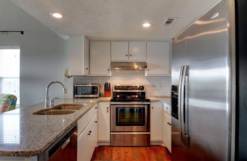 Surf City Condo | Beautifully Updated TOP FLOOR Condo with Ocean & Pool Views