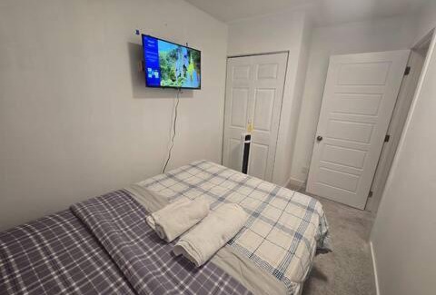 West Edmonton House | Bedroom with TV in Upland E