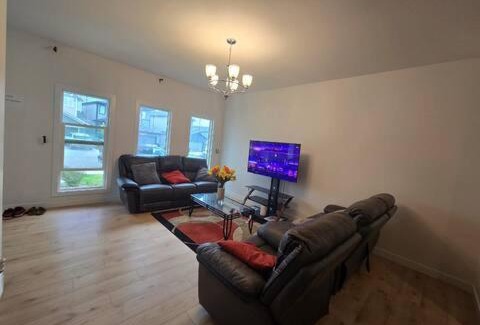 West Edmonton House | Bedroom with TV in Upland E