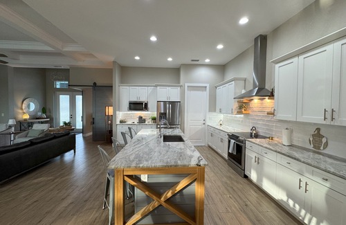 South Gulf Cove House | Bela-Vita-Charming 3-bedroom canal front pool home with 2 master suites