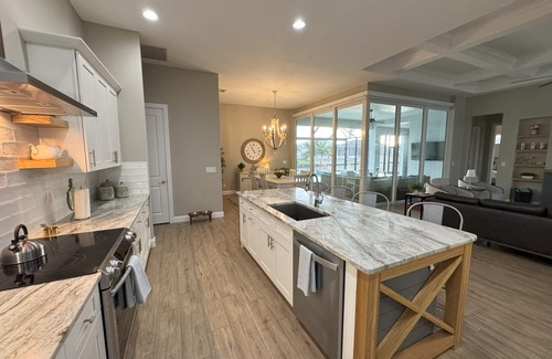 South Gulf Cove House | Bela-Vita-Charming 3-bedroom canal front pool home with 2 master suites