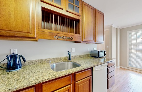 Ocean View Condo | Bethany Marina bayfront condo with pool, fireplace, water views