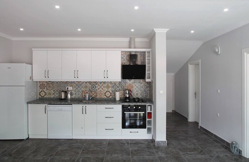 Fethiye Apartment | Bluberry Central Fethiye's apartments with Amyntas Rock Tombs view.