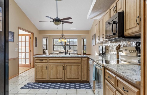 Palm Harbor House | Blue Haven Large Waterfront Pool Home | Boat Dock | Canal | Water Views | Pool Bar | WIFI | Fishing